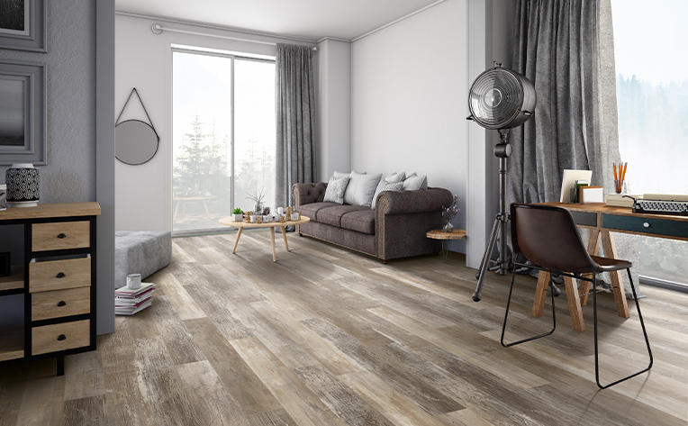 luxury vinyl flooring in a living room with a brown couch